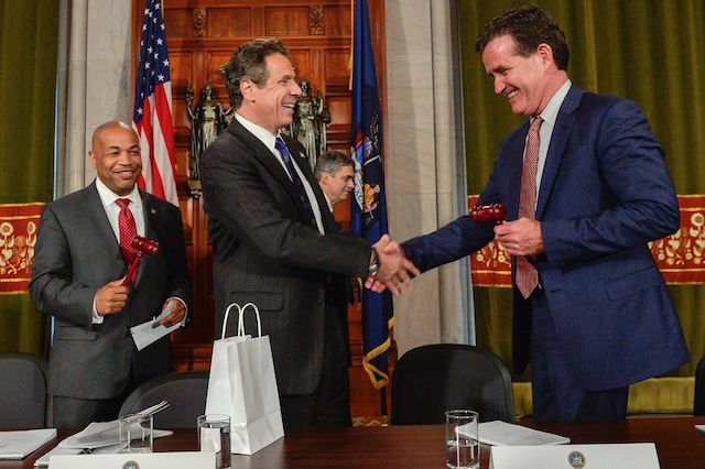 Governor Cuomo shakes the hand of Republican Senate Leader John Flanagan after announcing the "framework" for the "Big Ugly"